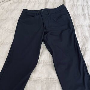 Men’s black commuter 5 pocket pants.